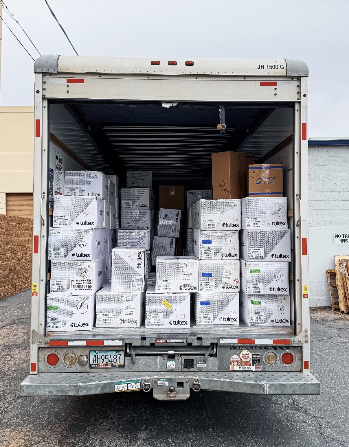 Shrink-wrapped pallets staged on the dock for blind drop-shipping